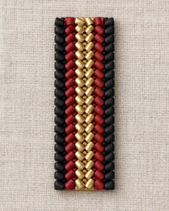 Flat herringbone bracelet band stitched with black, red and gold Miyuki Delica beads